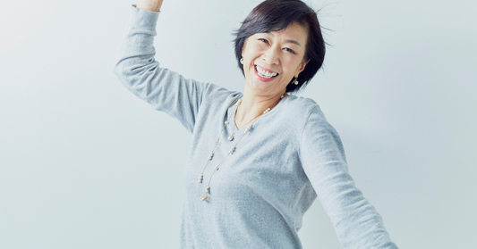 Woman in her 50s feeling energized, representing menopause wellness and lactoferrin benefits.