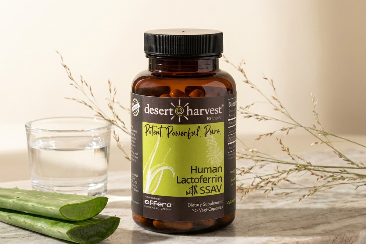 Desert Harvest Human Bioidentical Lactoferrin bottle with Aloe Vera on a soft morning table