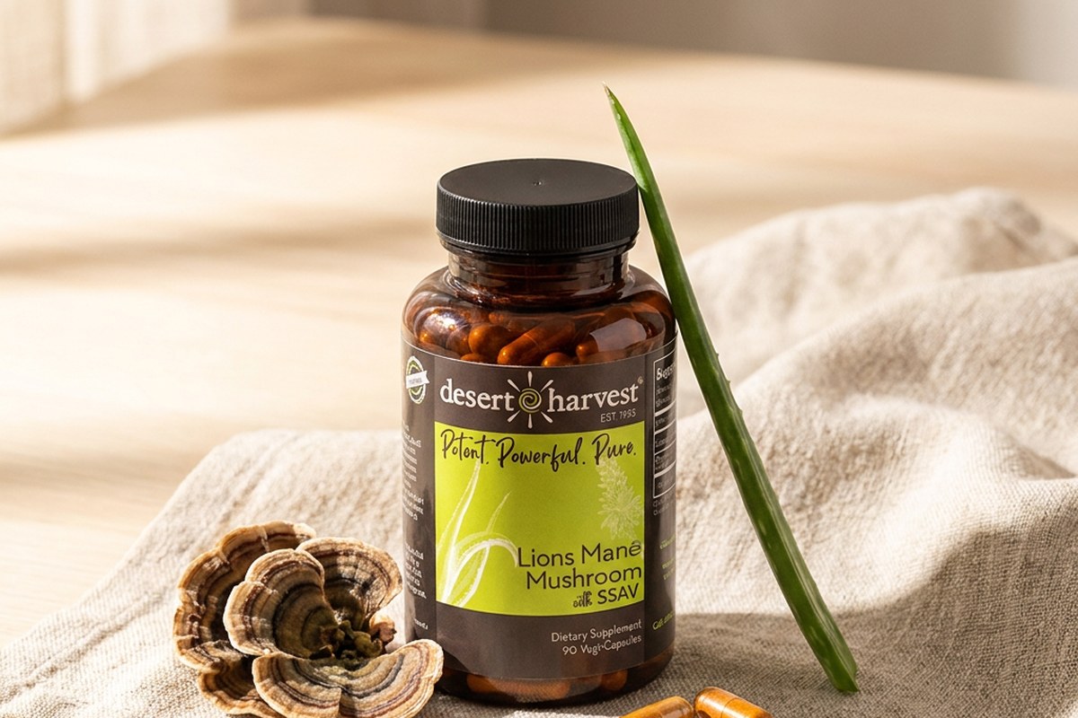 Desert Harvest Turkey Tail bottle with dried mushroom brackets and Aloe Vera on warm linen