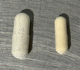 Desert Harvest Multi-Vitamin capsules side by side: the old capsule on the left, the new, smaller capsule on the right
