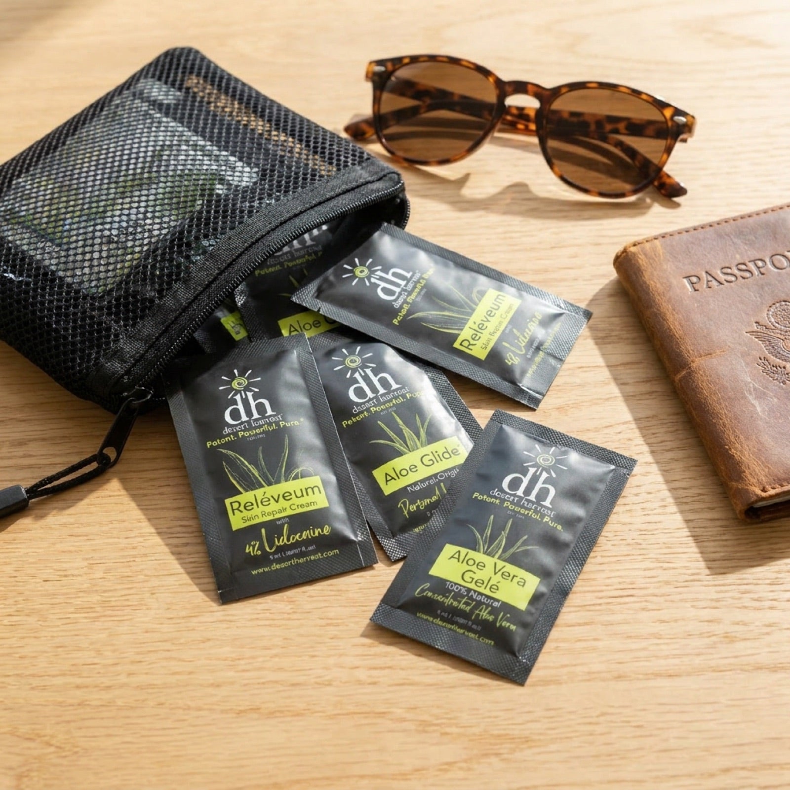Variety travel packets with sunglasses and passport